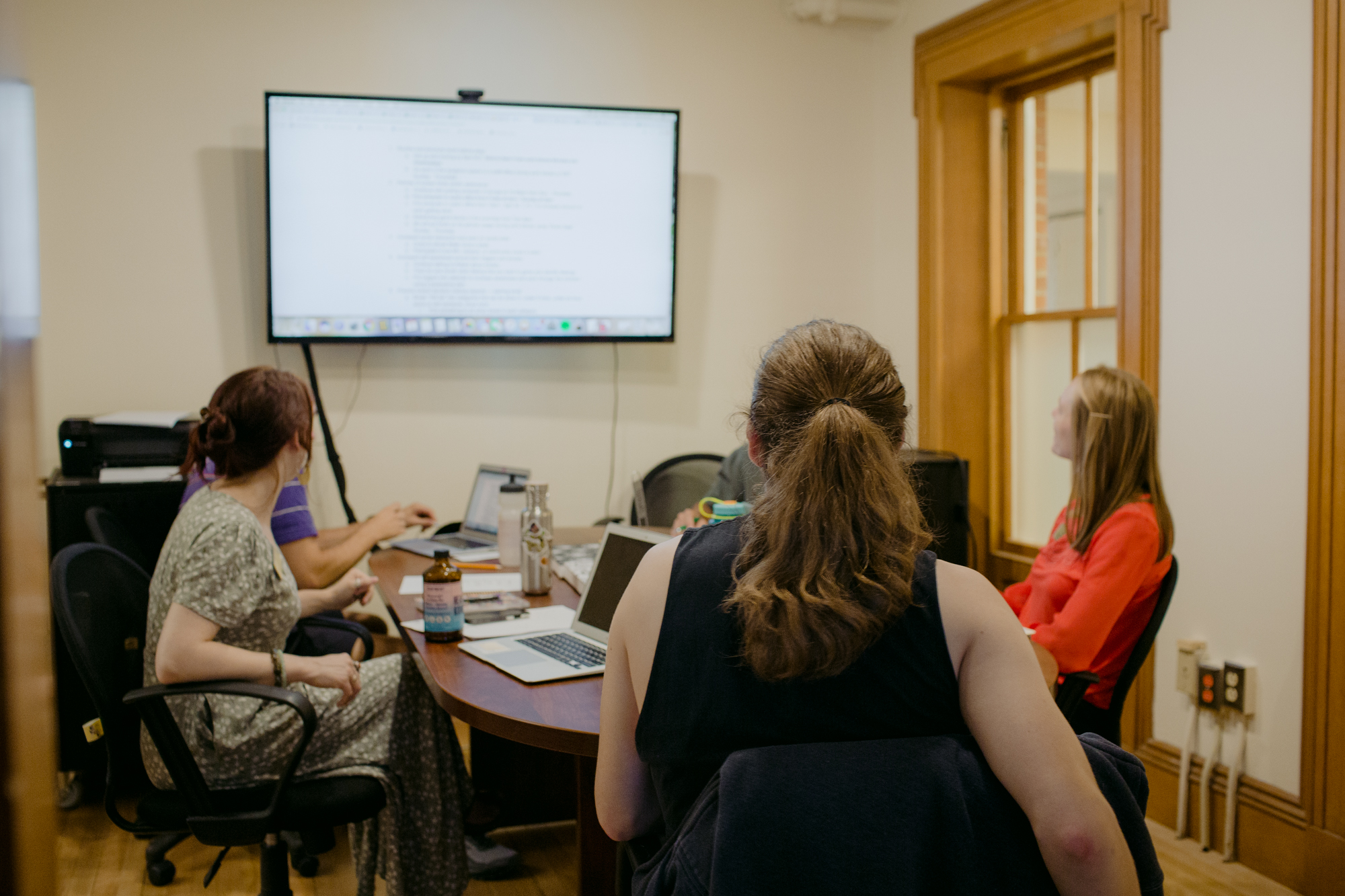 Mansfield Hall - Burlington - Team Members in meeting