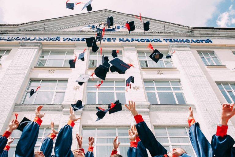 Student throwing graduation caps