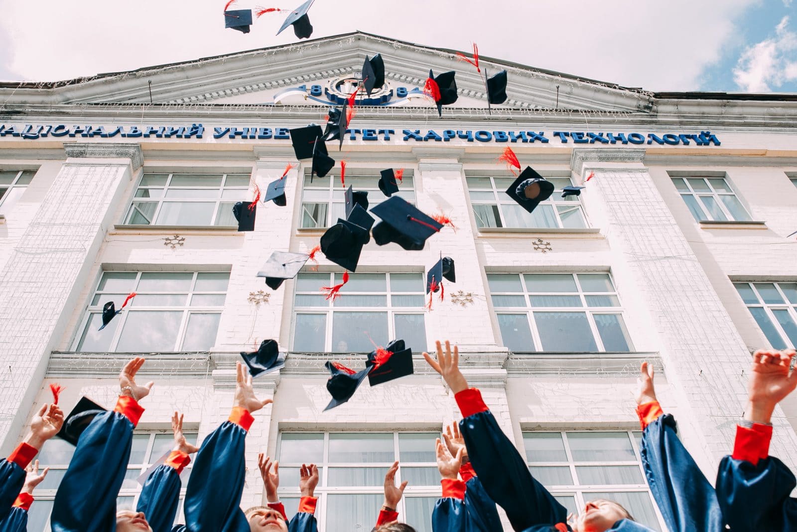 Student throwing graduation caps