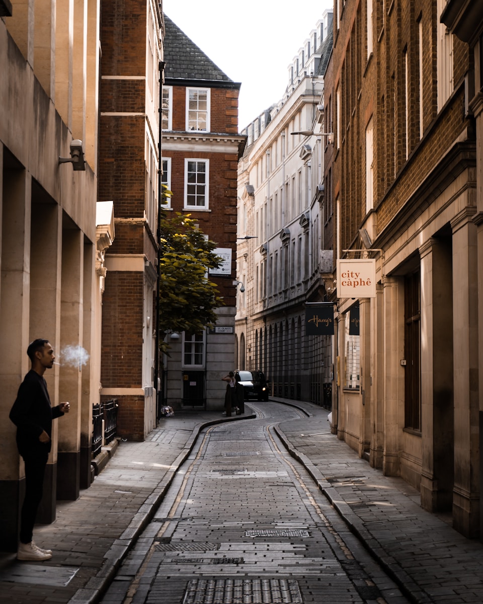 red telephone booth near building during daytime