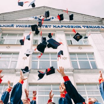 Student throwing graduation caps